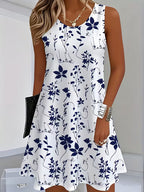 Floral sleeveless mini dress, white with navy blue flower and vine pattern