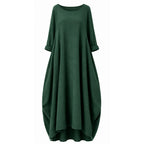 Green round-neck maxi dress with 3/4 sleeves and loose draped silhouette