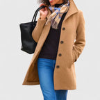 Khaki long coat with button front, notched lapels, and side pockets