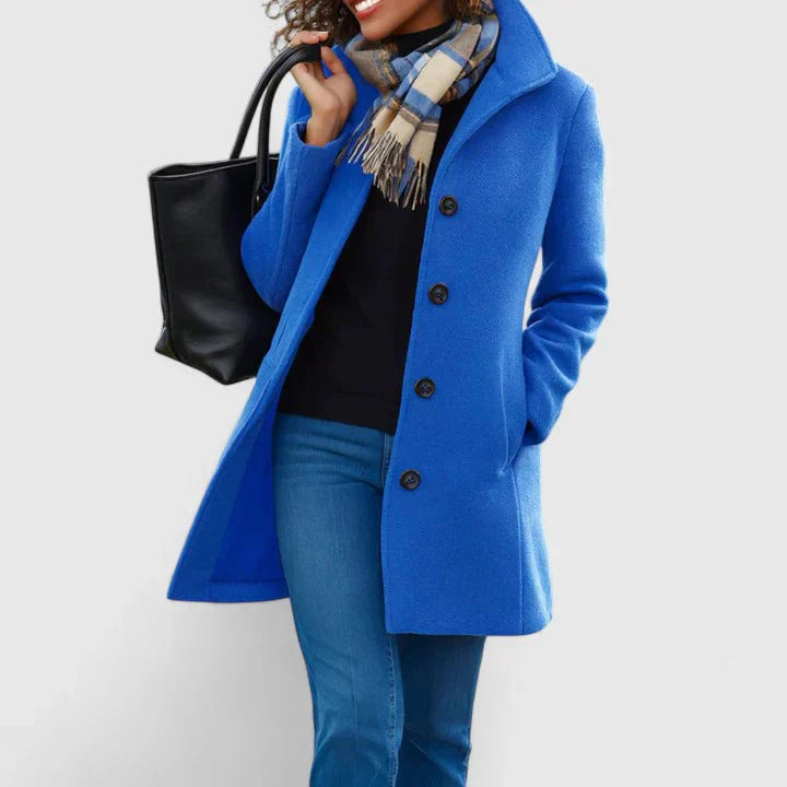Blue long coat with button front, notched lapels, and side pockets