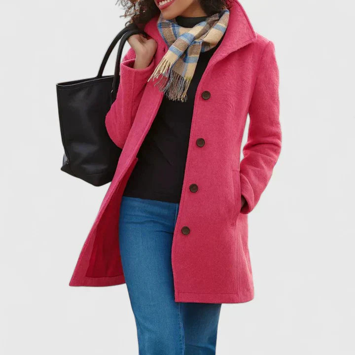 Pink long coat with button front, notched lapels, and side pockets