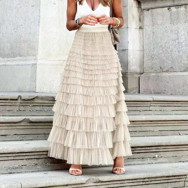 Women's tulle maxi skirt with tiered ruffle layers, light beige, mid-thigh to hem
