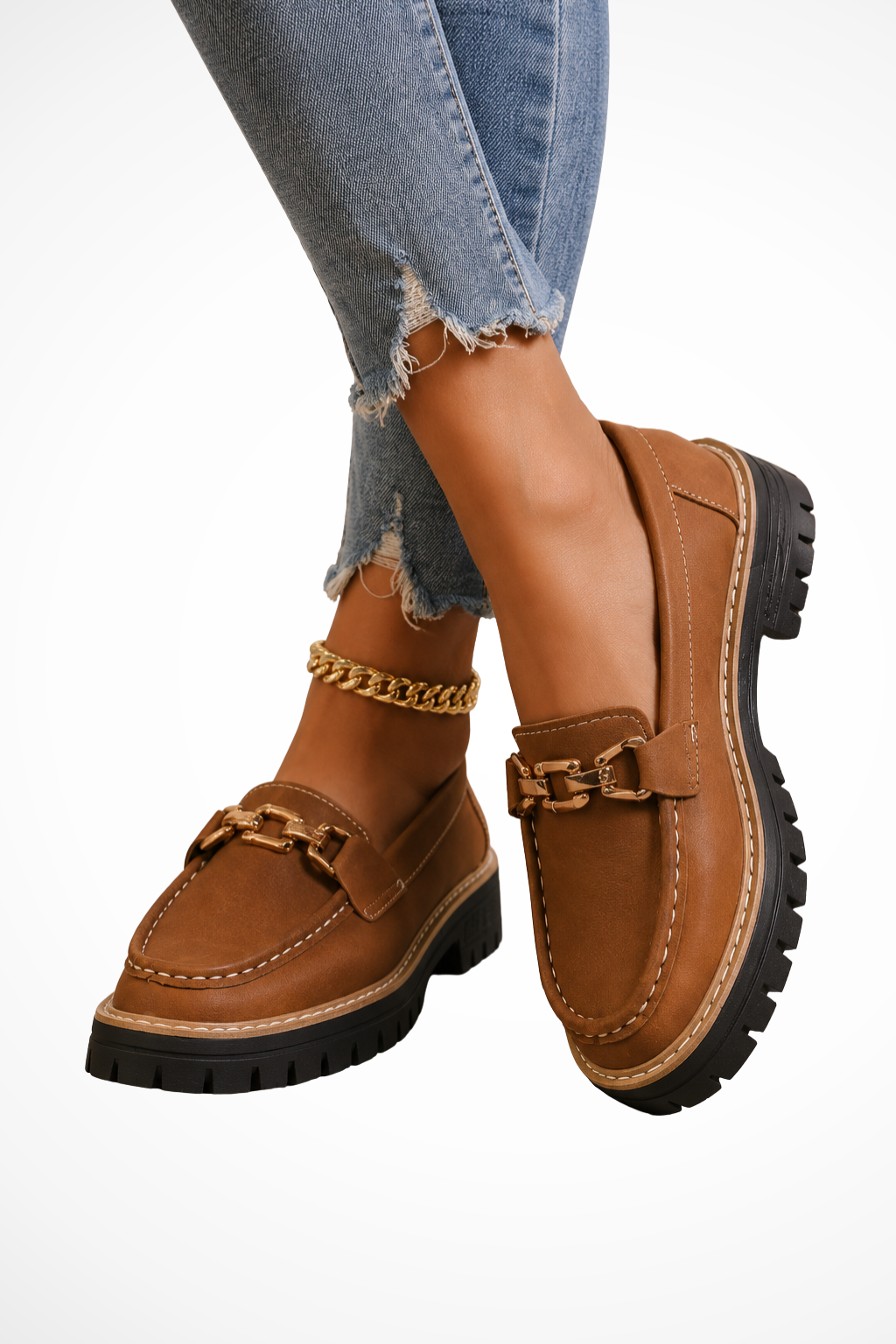 Brown chunky-sole slip-on loafers with gold chain detail and buckle strap