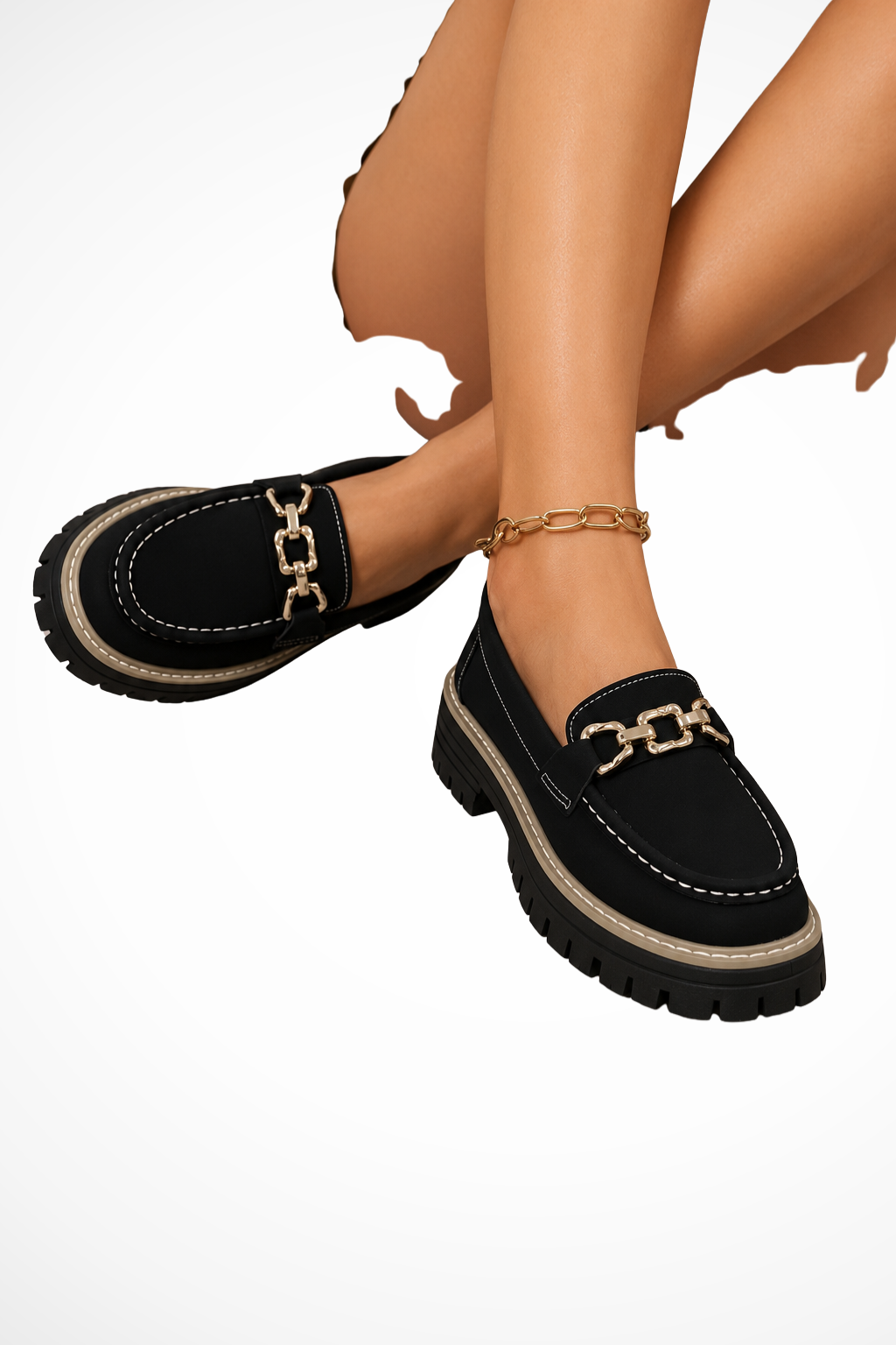 Black chunky-sole slip-on loafers with gold chain accent and buckle detail