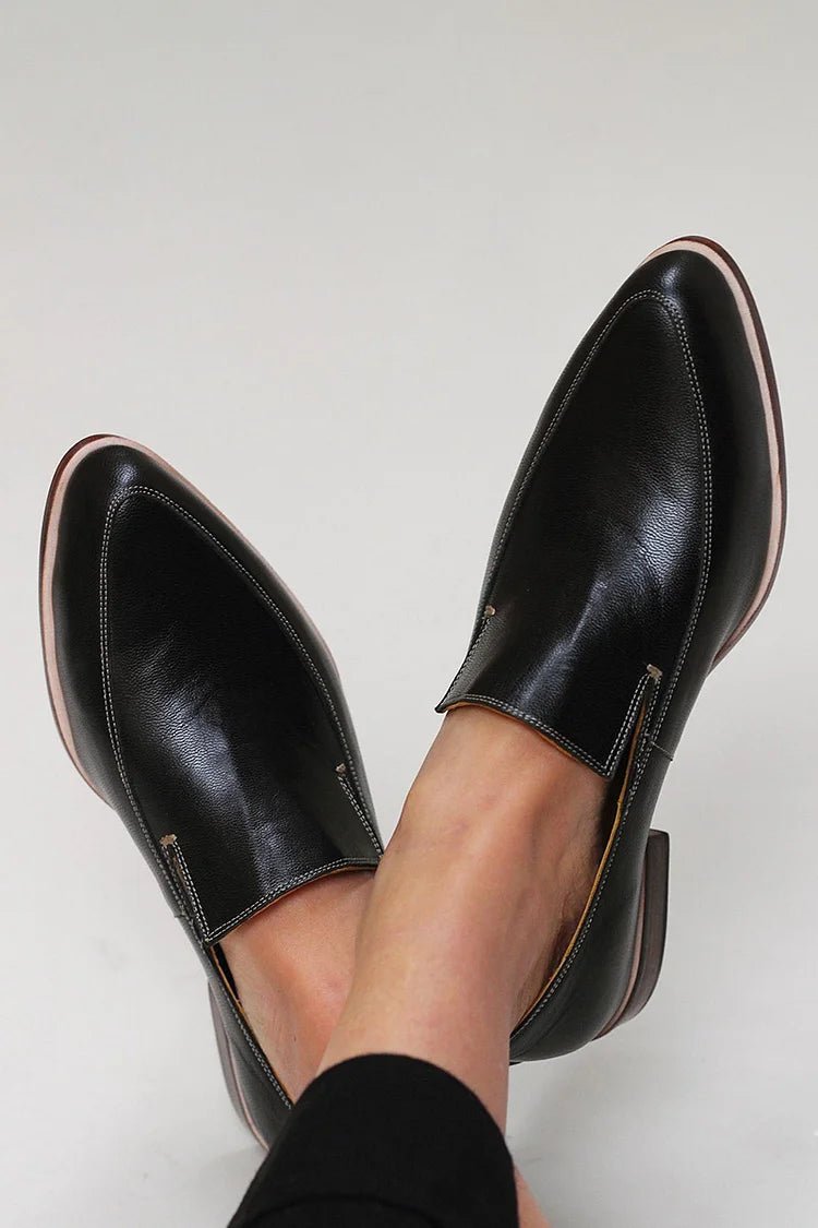 Women's black leather slip-on loafers, low-profile with minimal stitching