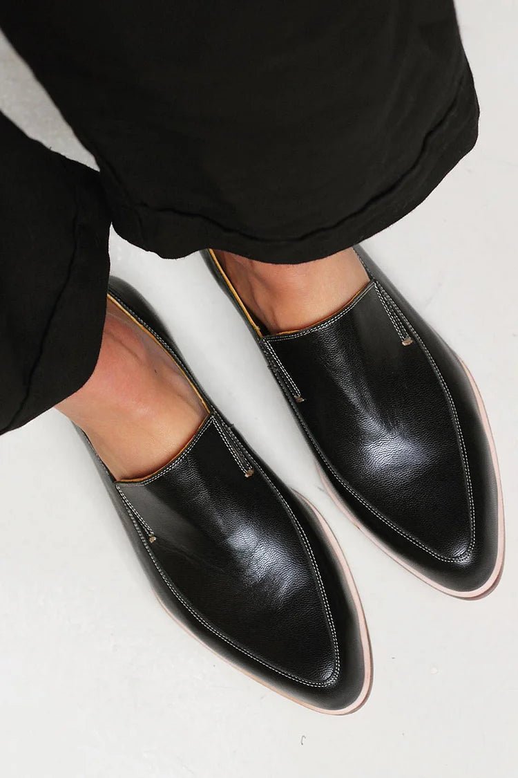 Women's black leather slip-on loafers, pointed loafer shape with stitched edges