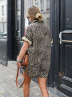 Brown leopard print romper jumpsuit back view with short sleeves and button-up back yoke