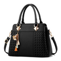Women’s shoulder bag, black textured front panel, top handles and side strap