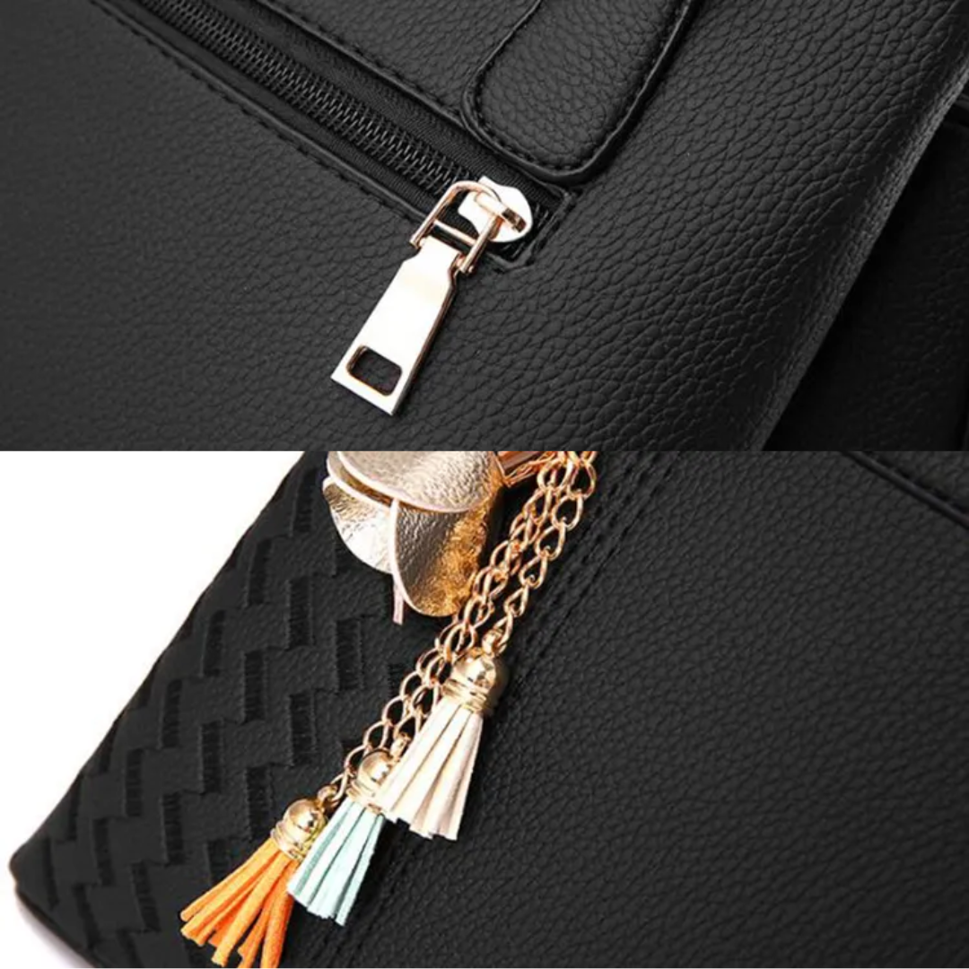 Black shoulder bag zipper and tassel chain charm with gold-tone metal accents