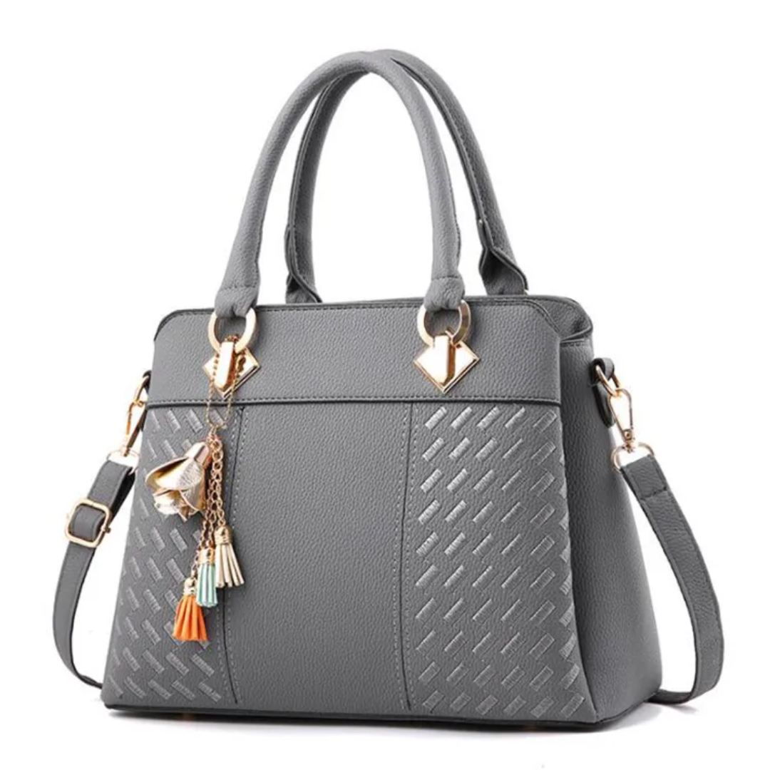 Gray women’s shoulder bag with textured panel, top handles, and crossbody strap