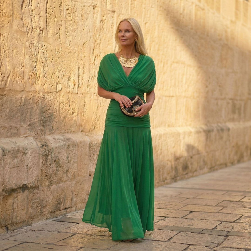 Green off-shoulder pleated maxi dress with draped crossover neckline