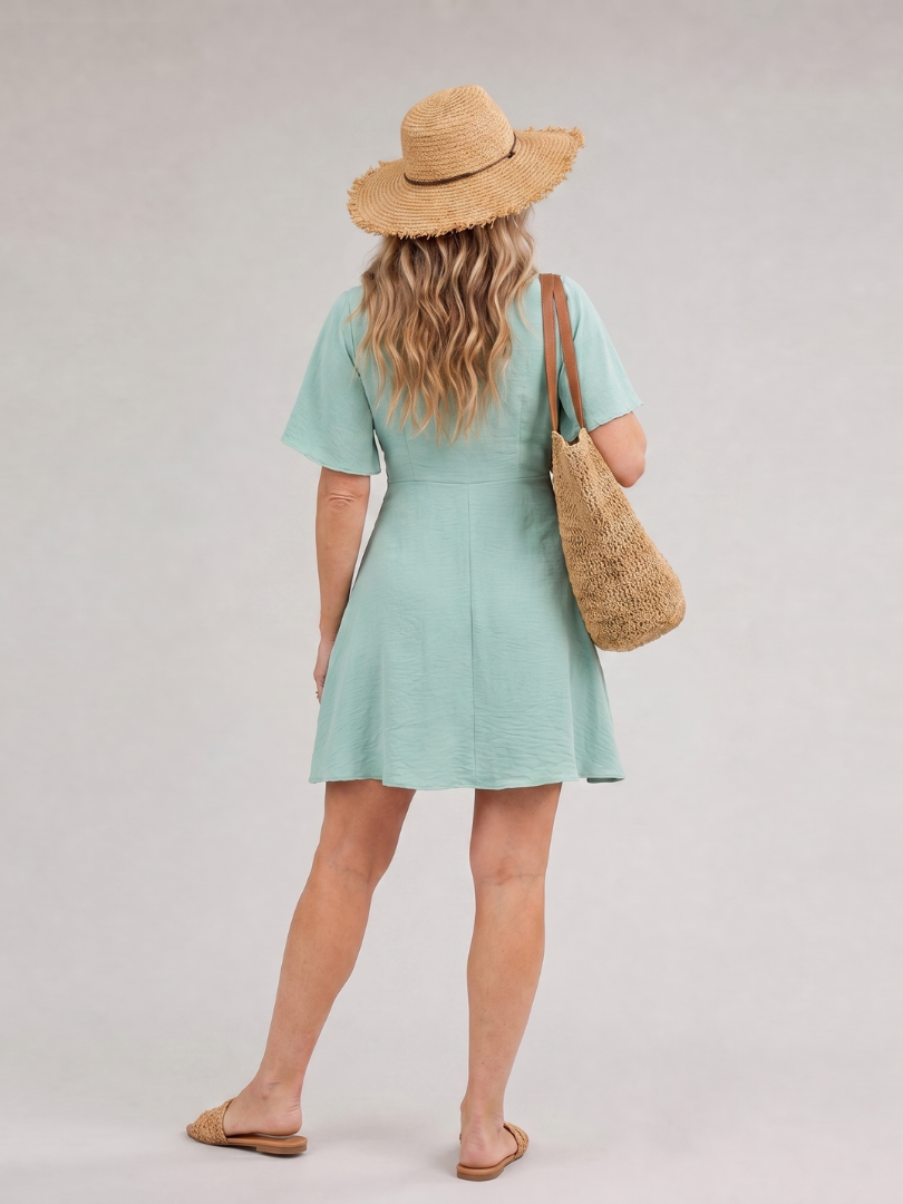 Mint green mini dress back view with flutter sleeves and flared skirt