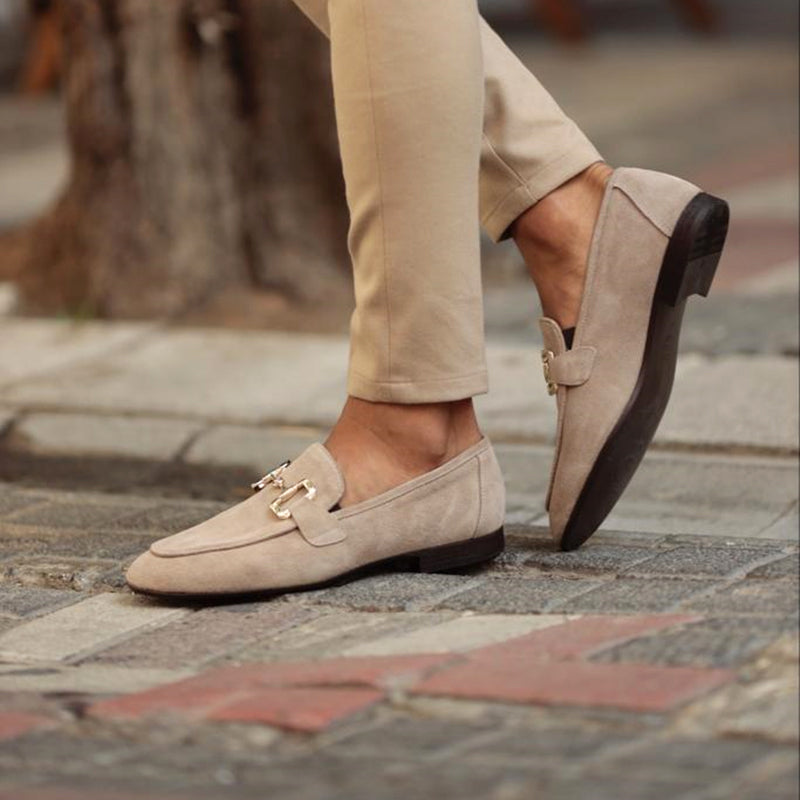 Beige suede slip-on loafers with horsebit and low profile heel