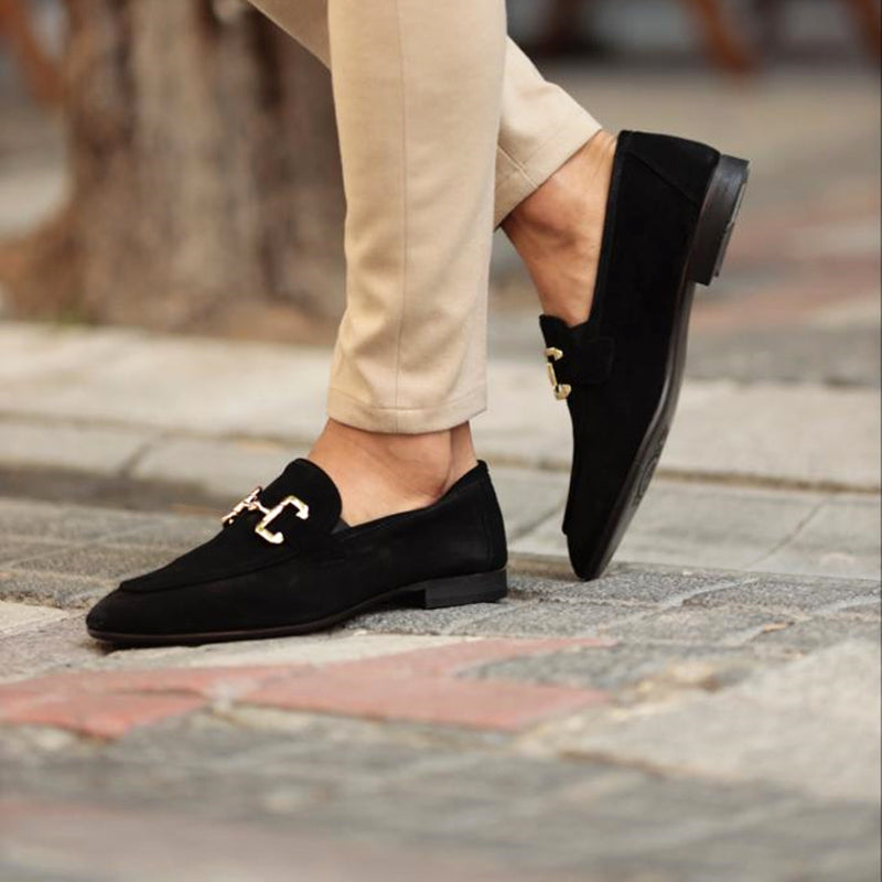 Black suede slip-on loafers with gold-tone horsebit accent