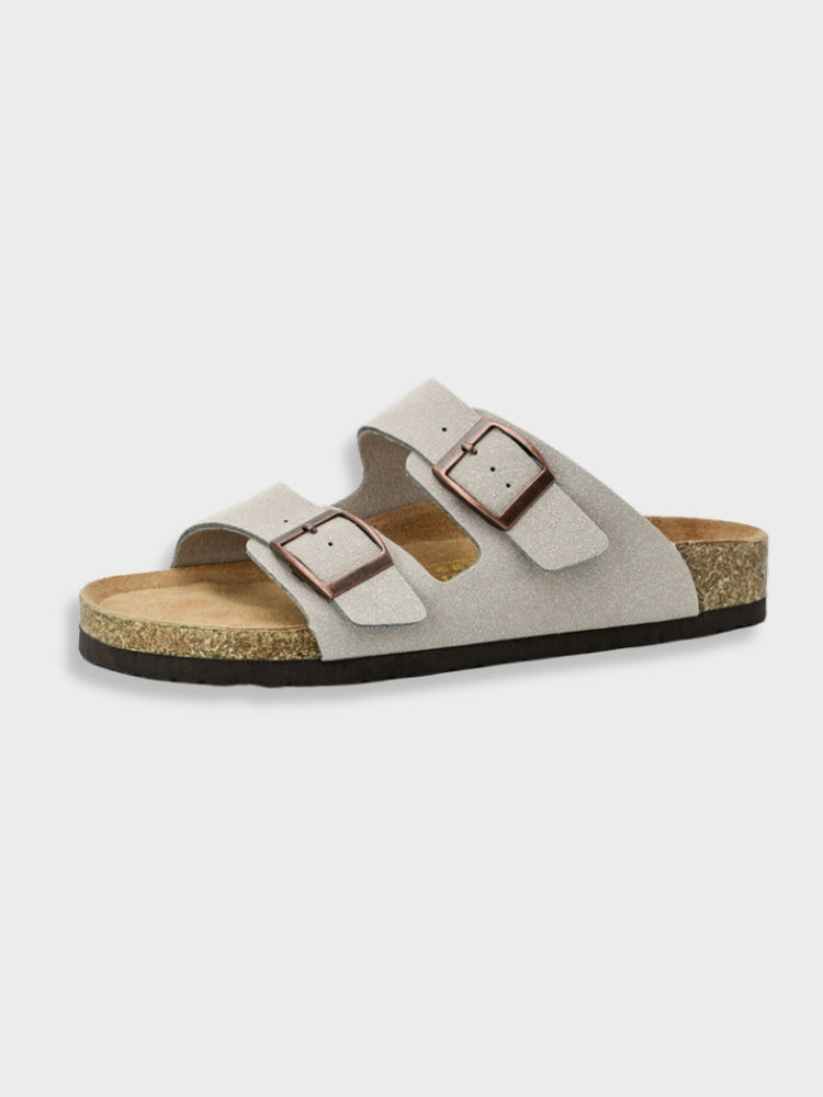 Light gray adjustable buckle slide sandals with two metal-look buckle straps and cork insole