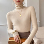 Ivory slim fit turtleneck sweater with long sleeves and ribbed knit cuffs