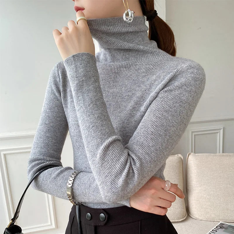 Light gray slim fit turtleneck sweater with long sleeves and ribbed knit