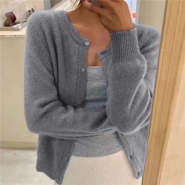 Grey women's cropped knit cardigan, button front and ribbed round neck.