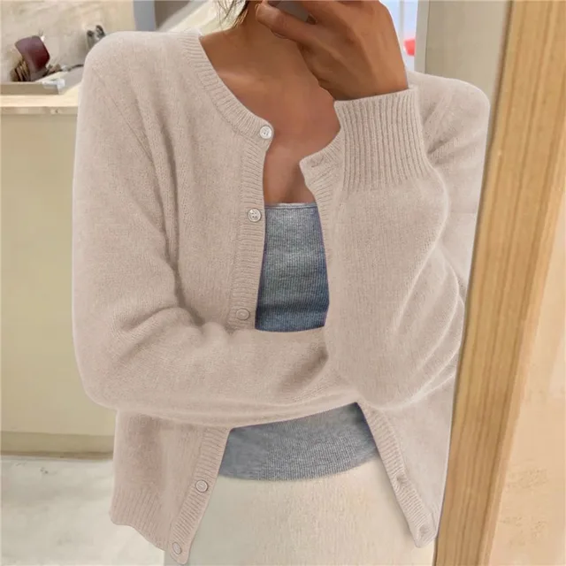 Beige women's cropped knit cardigan with button front and ribbed round neck.