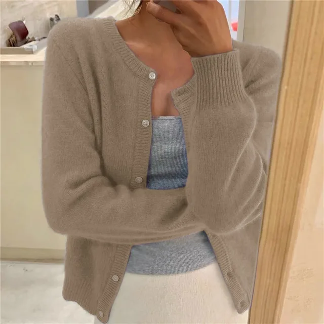 Beige women's cropped knit cardigan with button front and round neckline.