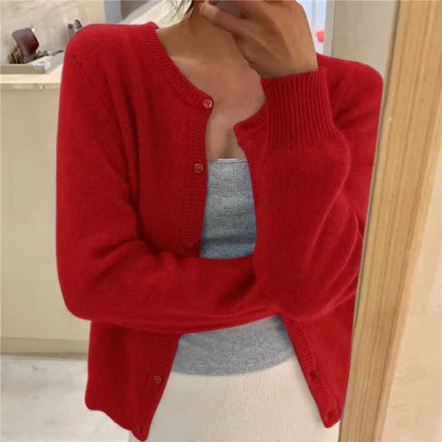 Red women's cropped knit cardigan with button front and ribbed round neck.