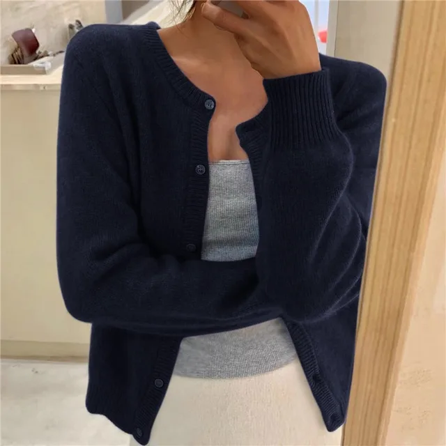 Navy blue cropped knit cardigan with round neck and button front, long sleeves