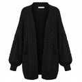 Black chunky knit open cardigan with long sleeves and textured cable-style knit