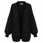 Black chunky knit open cardigan with long sleeves and textured cable-style knit