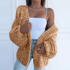 Brown chunky knit open cardigan with long sleeves and textured cable-style knit
