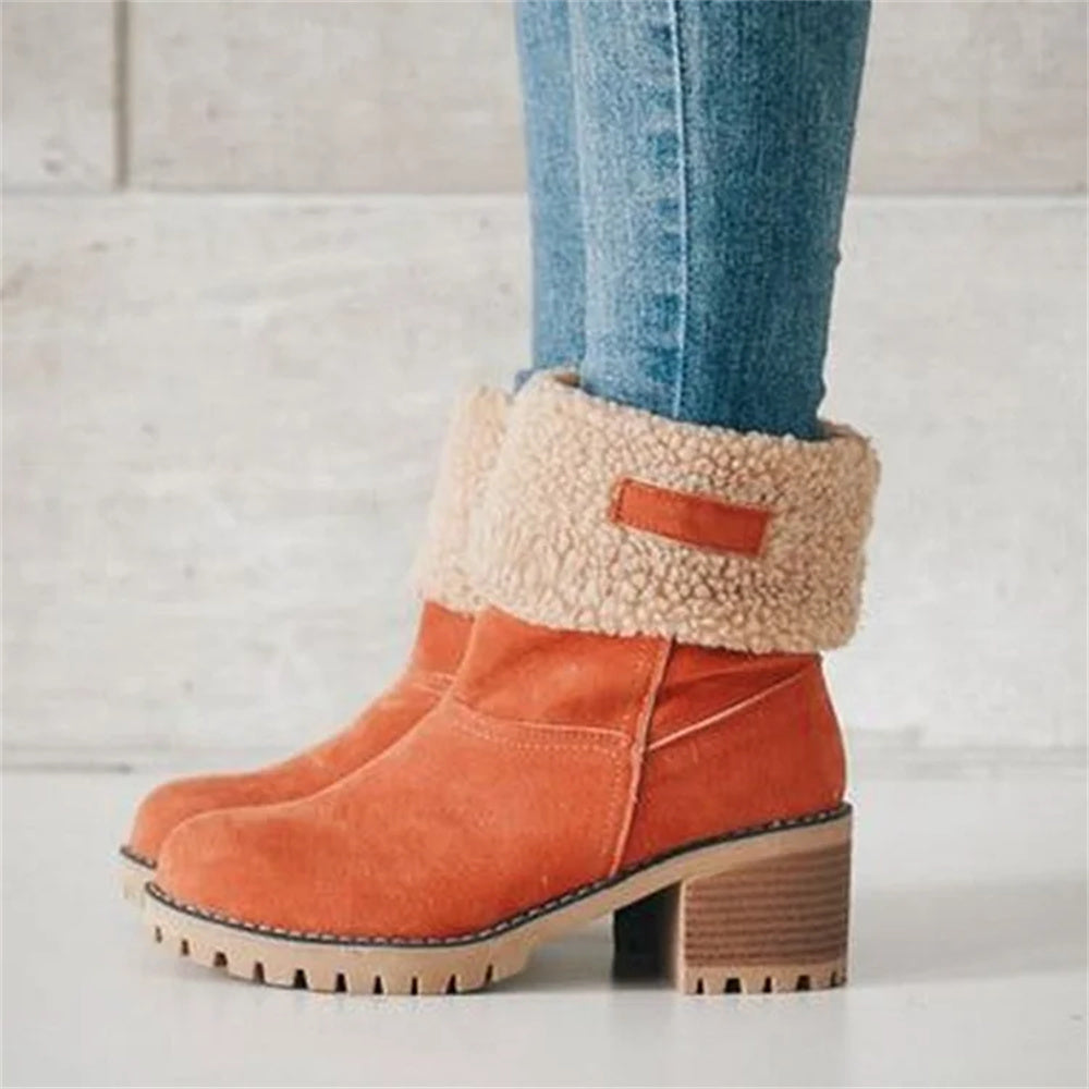 Women’s ankle boots in burnt orange suede with cream faux shearling cuff and block heel.