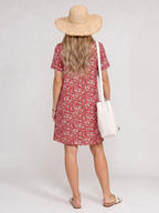 Back view of red short-sleeve knee-length dress with white floral print