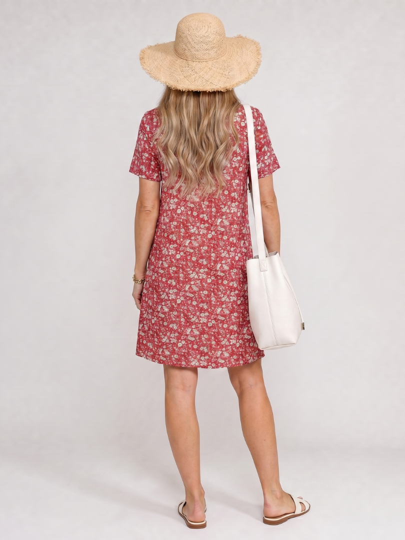 Back view of red short-sleeve knee-length dress with white floral print