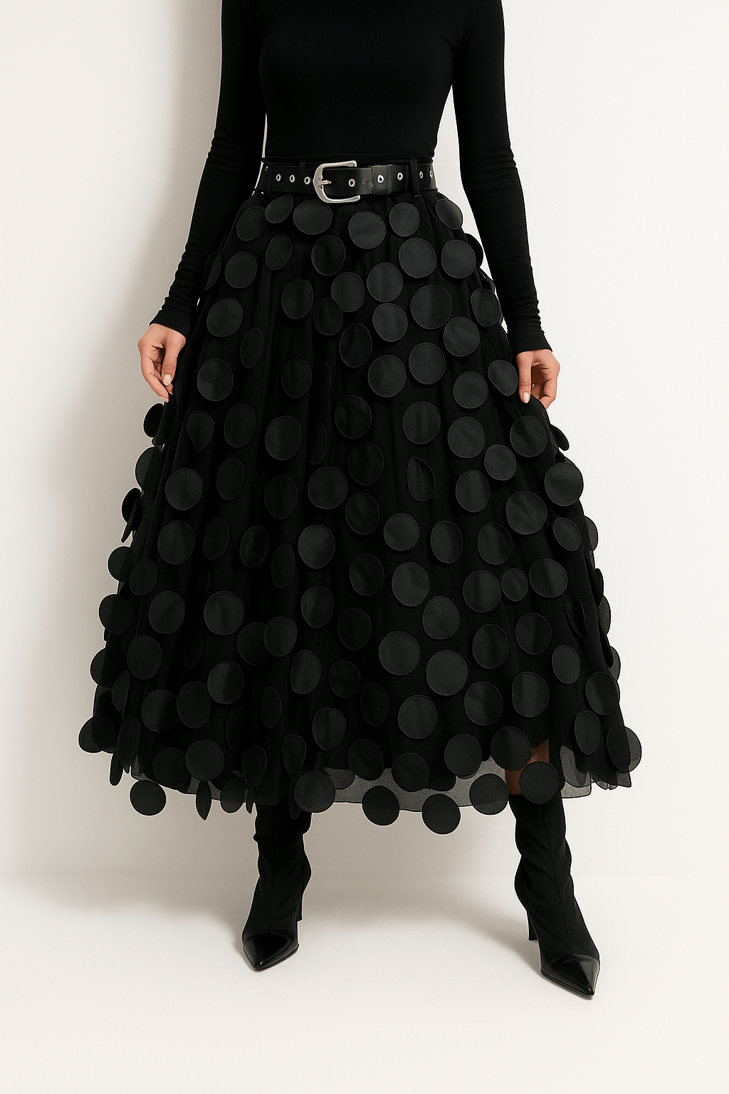 Women’s midi A-line skirt in black with large circular 3D dots and attached belt