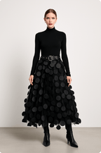 Women’s midi A-line skirt in black with large circular 3D dots, belted waist