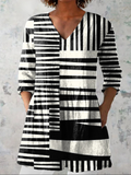 Black-and-white striped V-neck tunic blouse with three-quarter sleeves