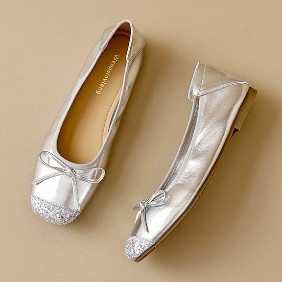 Pair of silver glitter square-toe ballet flats with bow ties and flat sole