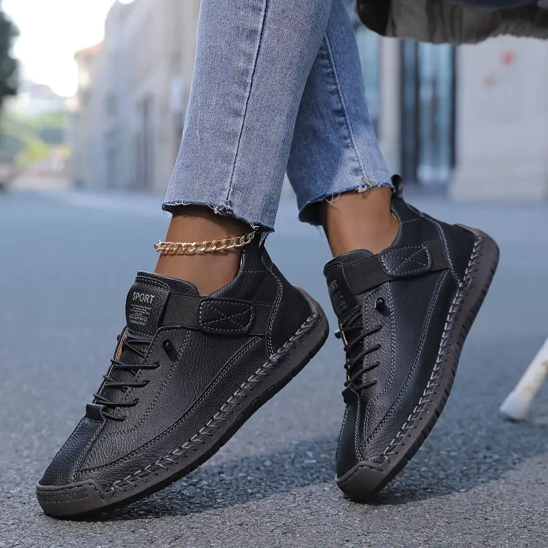Women's black cushioned leather lace-up sneakers with high-top ankle strap