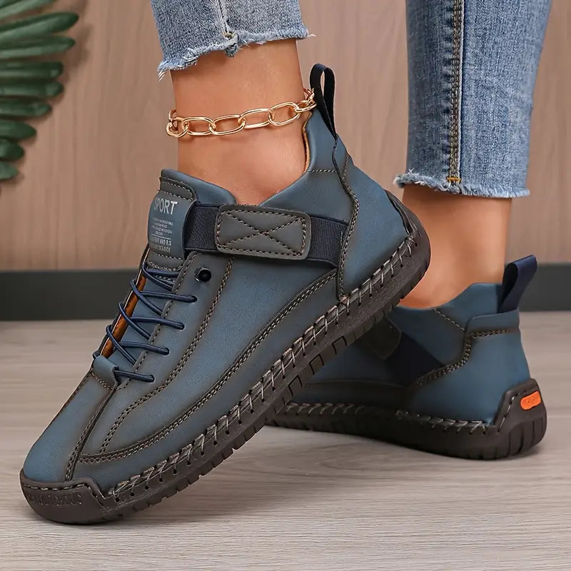 Women's blue cushioned leather lace-up sneakers with side strap and cushioned outsole