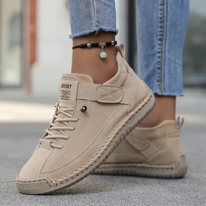 Women's beige cushioned leather lace-up sneakers with side velcro strap and padded sole