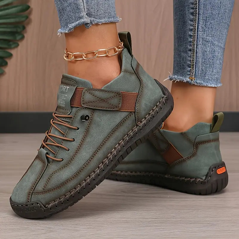Women's green cushioned leather lace-up sneakers with ankle strap and rugged outsole