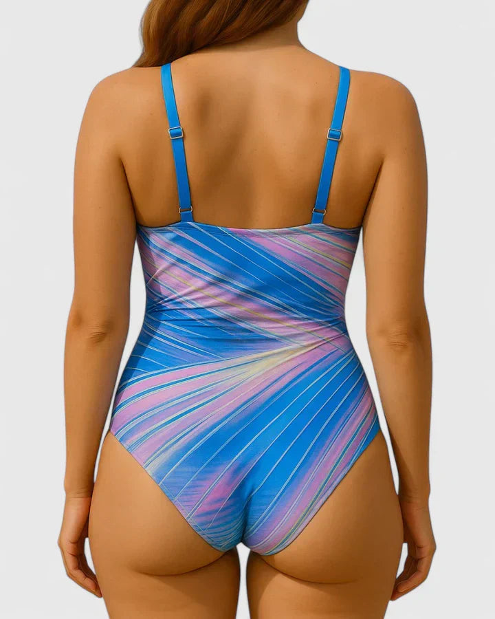 Back view of blue and pink striped one-piece swimsuit with adjustable straps