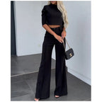 Black matching cropped top and high-waist wide-leg trouser set with front buttons and pockets
