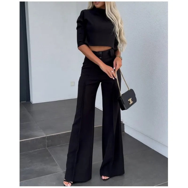 Black matching cropped top and high-waist wide-leg trouser set with front buttons and pockets