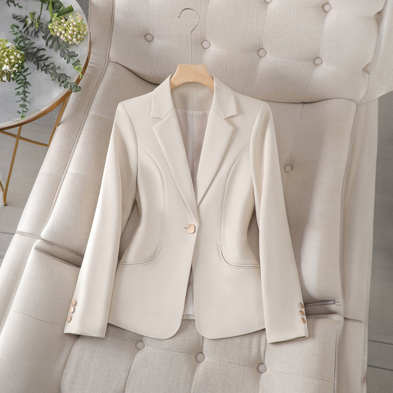 Women’s beige notched-collar blazer with gold buttons and flap pockets, long sleeves