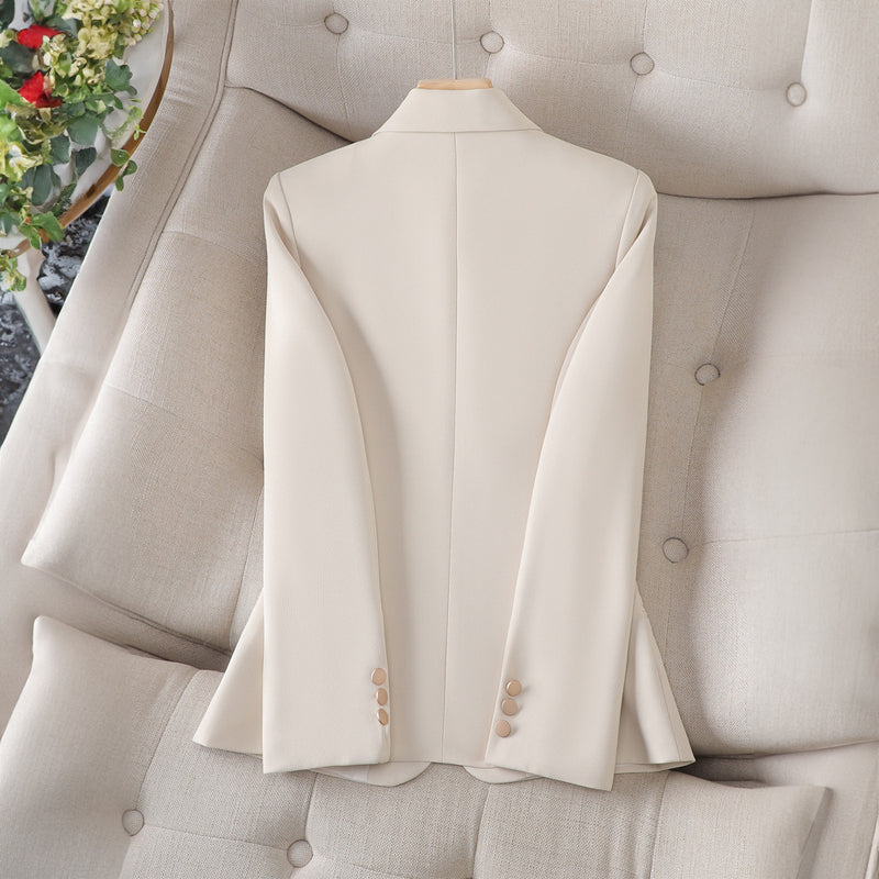 Women’s beige blazer back view with center seam and gold button detail, long sleeves