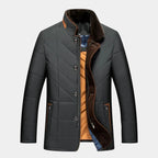 Men's quilted fall jacket in dark gray/black with faux-fur collar trim and snap buttons