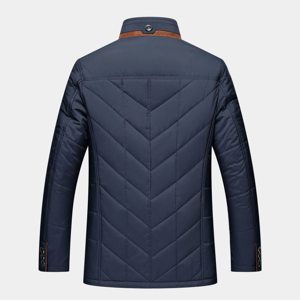 Men's blue quilted fall jacket back with chevron stitching and stand collar