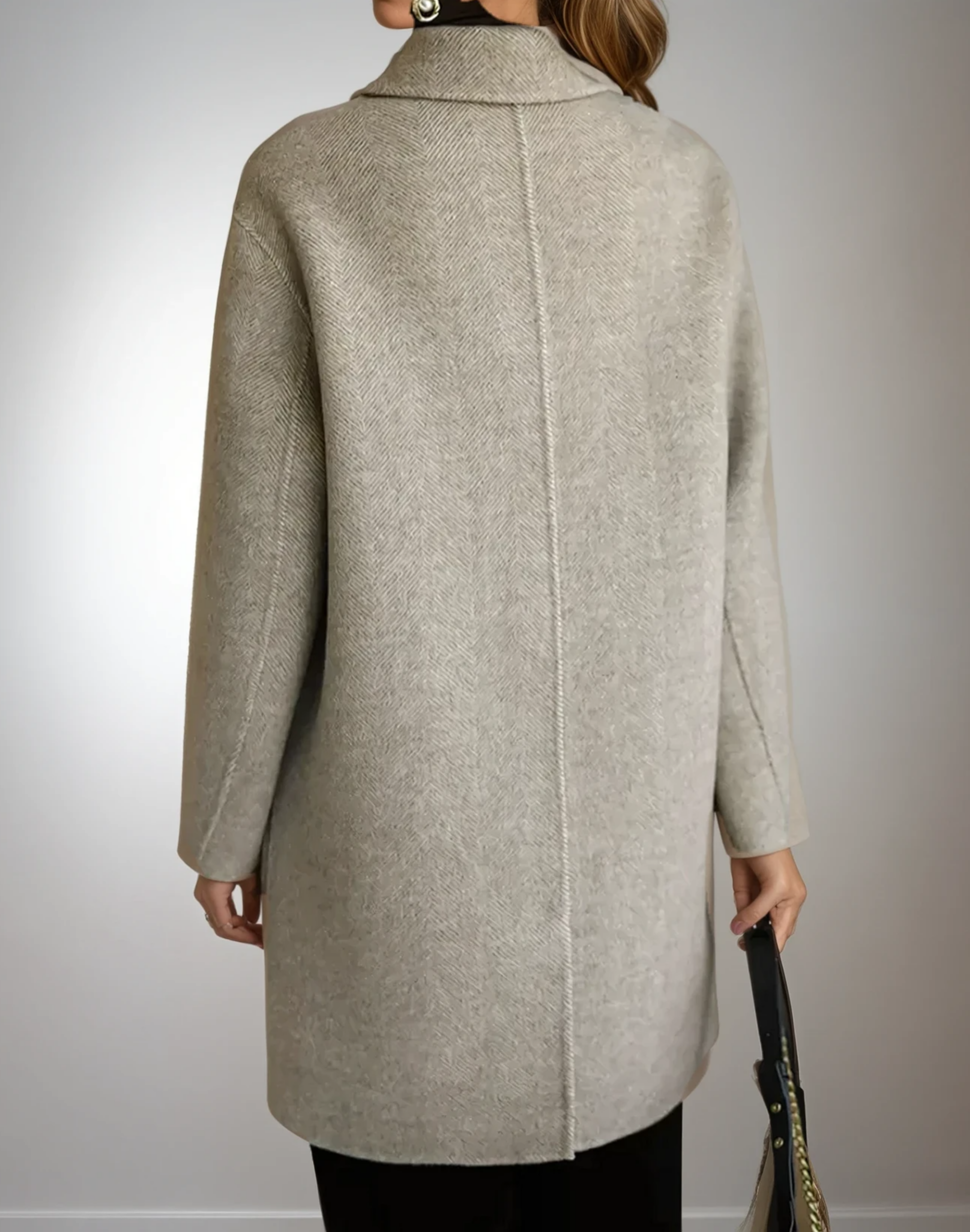 Beige long coat back view with raised seam and full-length sleeves