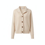 Beige knit cardigan with button front, long sleeves, and ribbed cuffs.