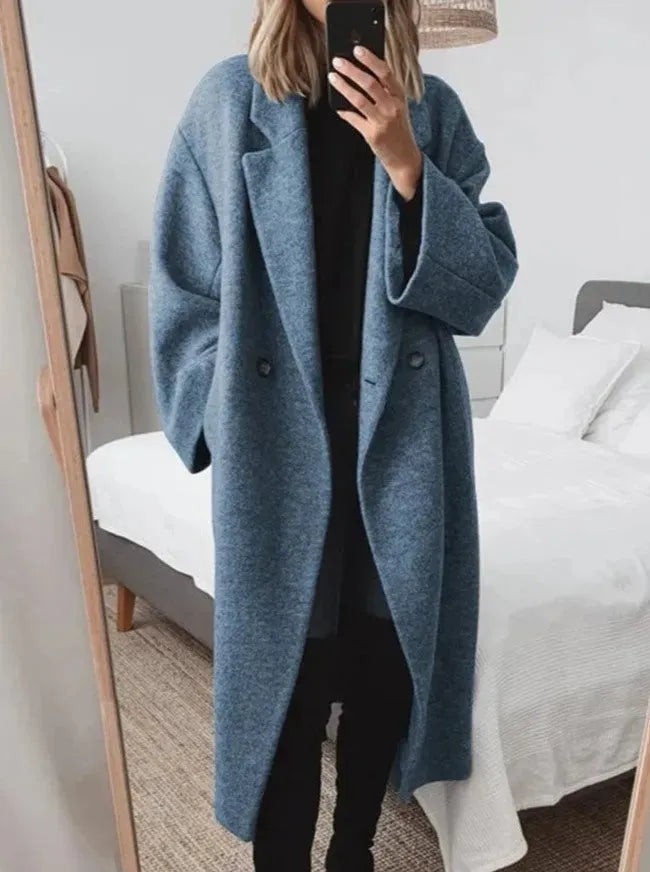 Blue long women's relaxed-fit coat with button front and oversized sleeves